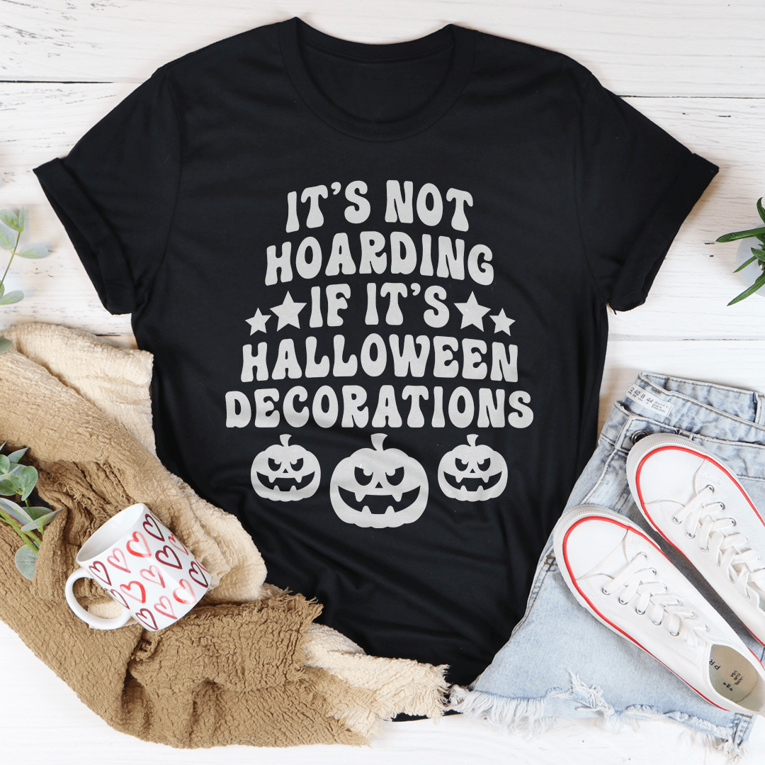 A comfortable Halloween-themed tee featuring the phrase 'It's Not Hoarding If It's Halloween Decorations' printed in vibrant colors.