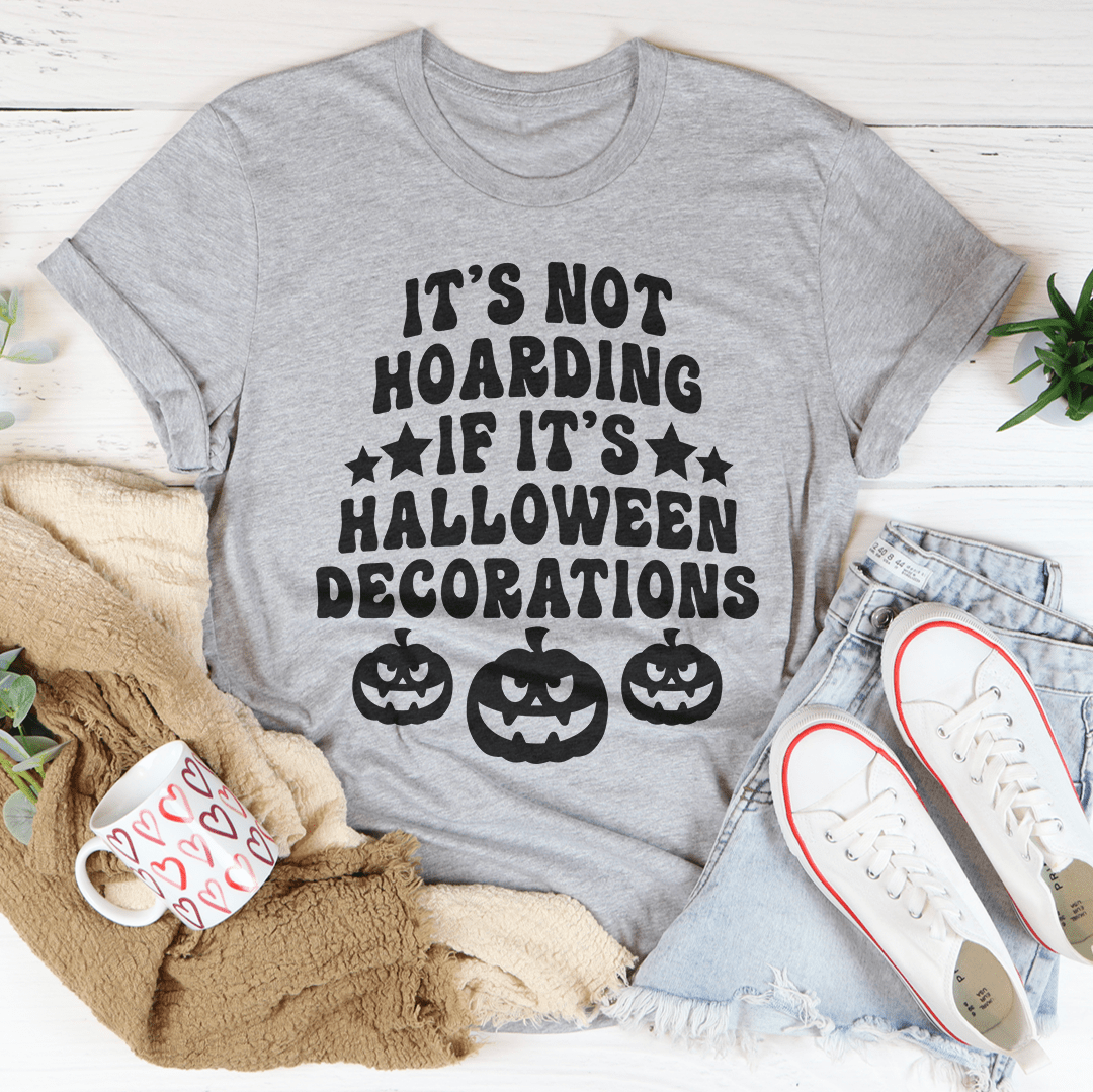 A comfortable Halloween-themed tee featuring the phrase 'It's Not Hoarding If It's Halloween Decorations' printed in vibrant colors.