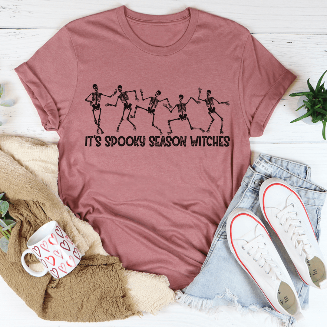 A stylish It's Spooky Season Witches Tee featuring vibrant Halloween-themed graphics, made from 100% soft cotton.