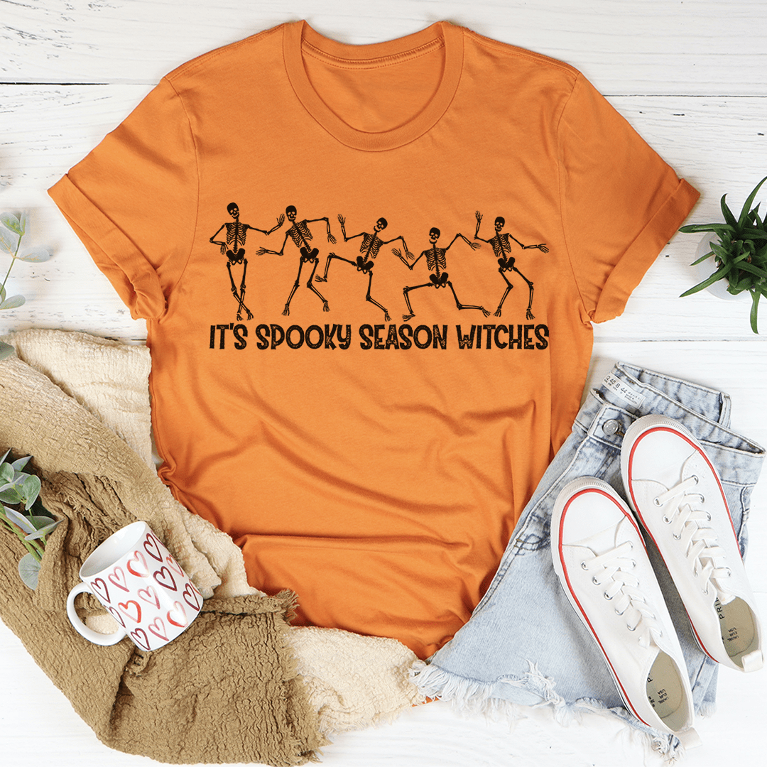 A stylish It's Spooky Season Witches Tee featuring vibrant Halloween-themed graphics, made from 100% soft cotton.