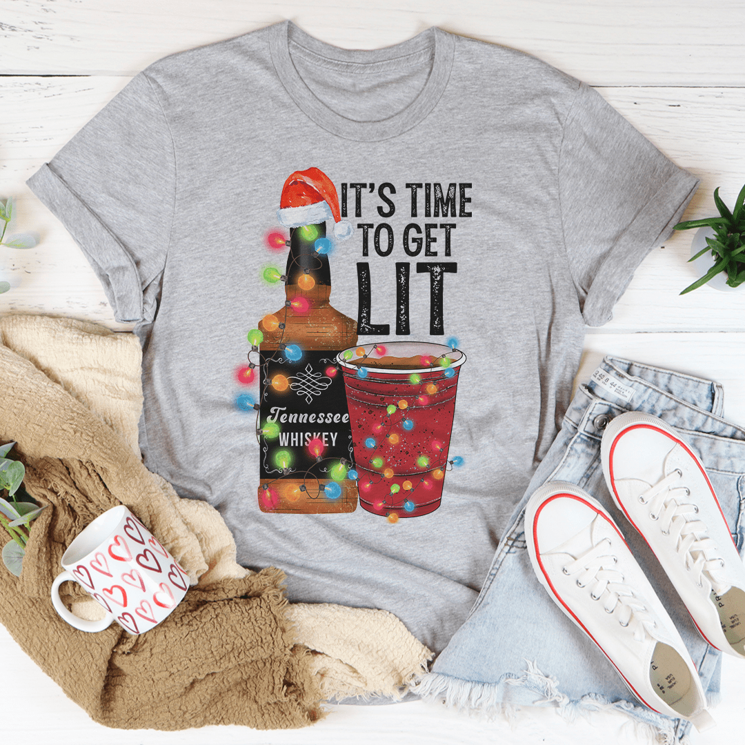 A festive Christmas-themed tee featuring the phrase 'It's Time To Get Lit', made from 100% soft cotton with vibrant digital printing.