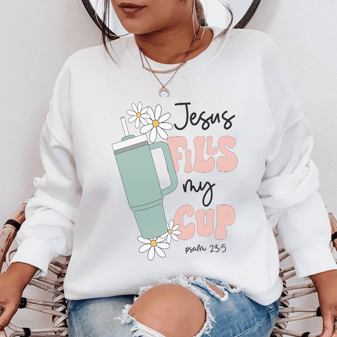 A cozy Jesus Fills My Cup Psalm hoodie featuring a warm fleece lining and adjustable cuffs, perfect for expressing faith and style.