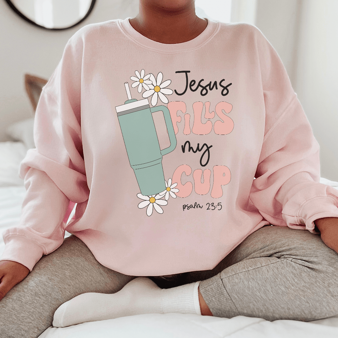 A cozy Jesus Fills My Cup Psalm hoodie featuring a warm fleece lining and adjustable cuffs, perfect for expressing faith and style.