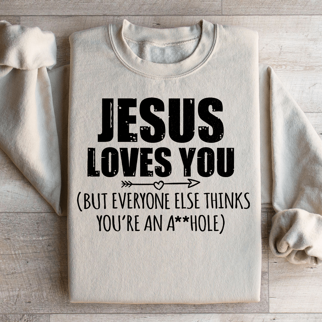 A cozy 'Jesus Loves You' hoodie made from cotton/poly fleece blend, featuring adjustable banded cuffs and unique artistic design.
