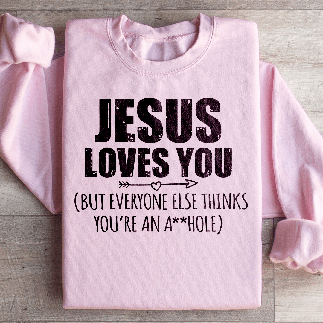 A cozy 'Jesus Loves You' hoodie made from cotton/poly fleece blend, featuring adjustable banded cuffs and unique artistic design.