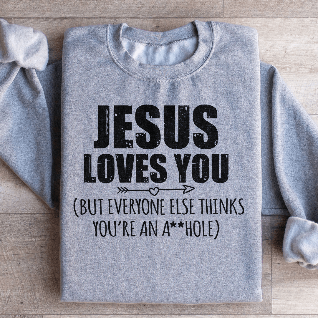 A cozy 'Jesus Loves You' hoodie made from cotton/poly fleece blend, featuring adjustable banded cuffs and unique artistic design.