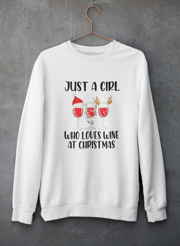 A cozy sweatshirt featuring the phrase 'Just A Girl Who Loves Wine At Christmas', perfect for holiday celebrations.