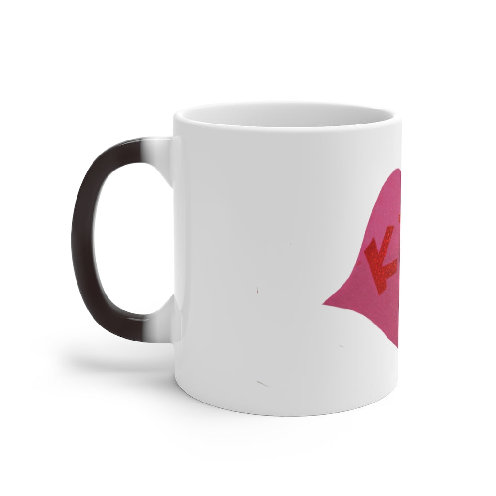 Kiss Me Color Changing Mug showcasing vibrant colors when filled with a hot beverage, featuring a rounded design and C-handle.
