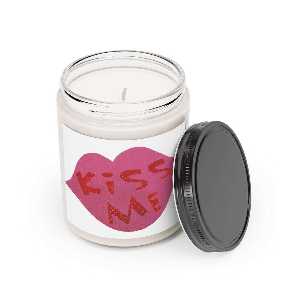 Kiss Me Scented Candle in a glass container, featuring a permanent label, showcasing its warm Cinnamon Stick and Vanilla fragrances.