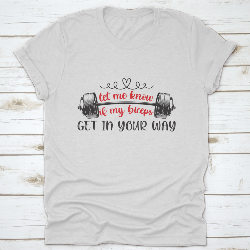 A stylish t-shirt featuring the phrase 'Let Me Know If My Biceps Get In Your Way' in a bold design, made from high-quality cotton.