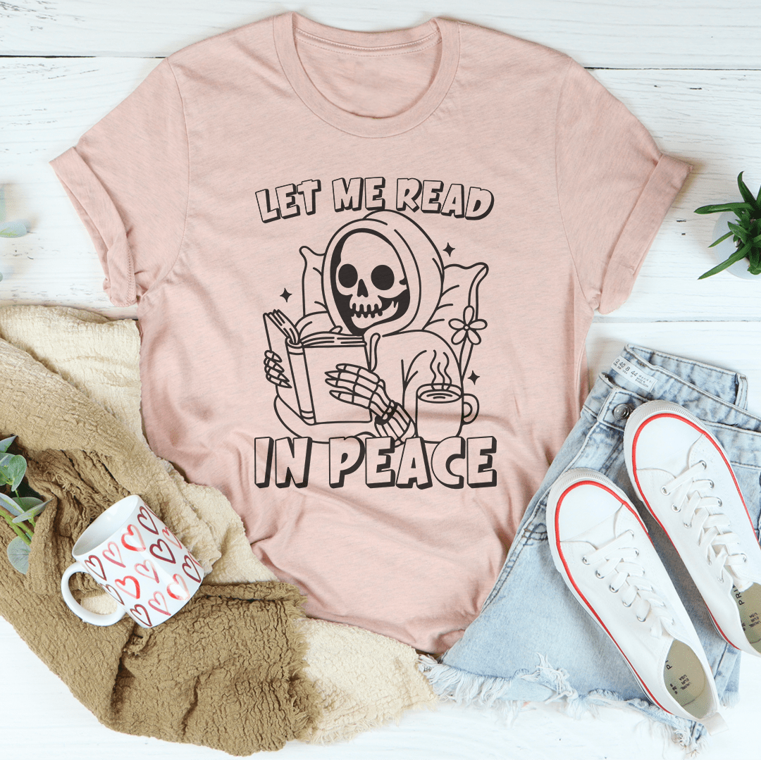 Let Me Read In Peace Tee, a unisex short sleeve jersey tee in soft cotton, featuring vibrant designs and a comfortable fit.