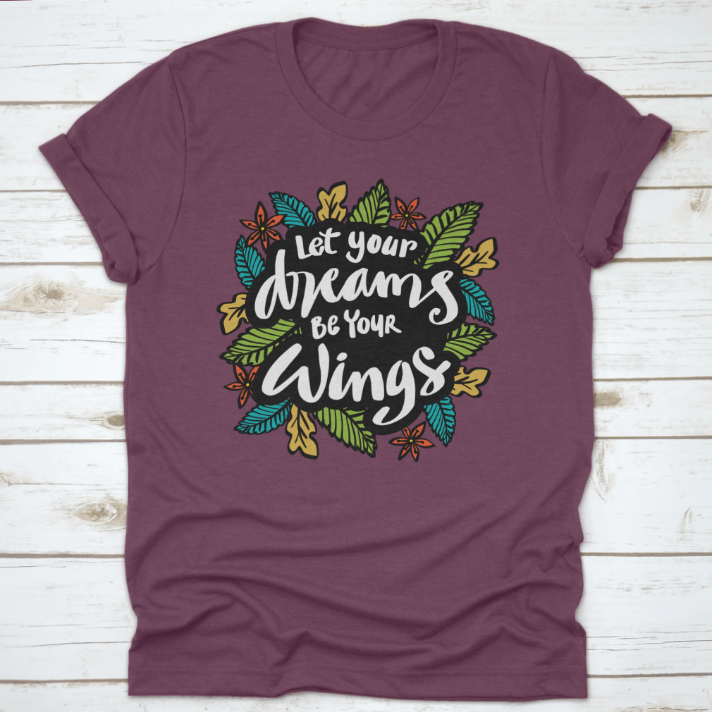 A stylish t-shirt featuring the inspirational quote 'Let Your Dreams Be Your Wings' in a beautiful design, made from soft cotton fabric.