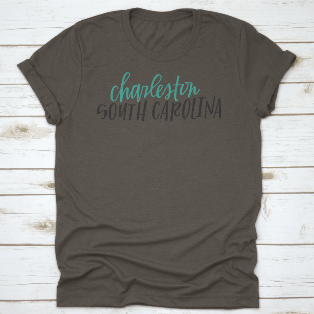 Lettering of Charleston, South Carolina typography design on a cotton shirt, showcasing vibrant colors and classic fit.