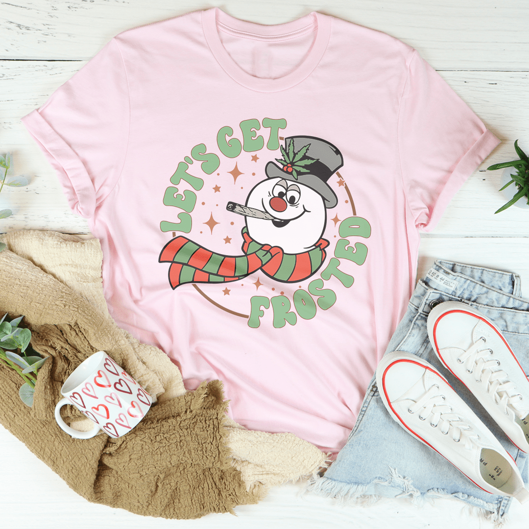 A festive Let's Get Frosted Tee featuring a cheerful Christmas design, made from 100% soft cotton, perfect for holiday celebrations.