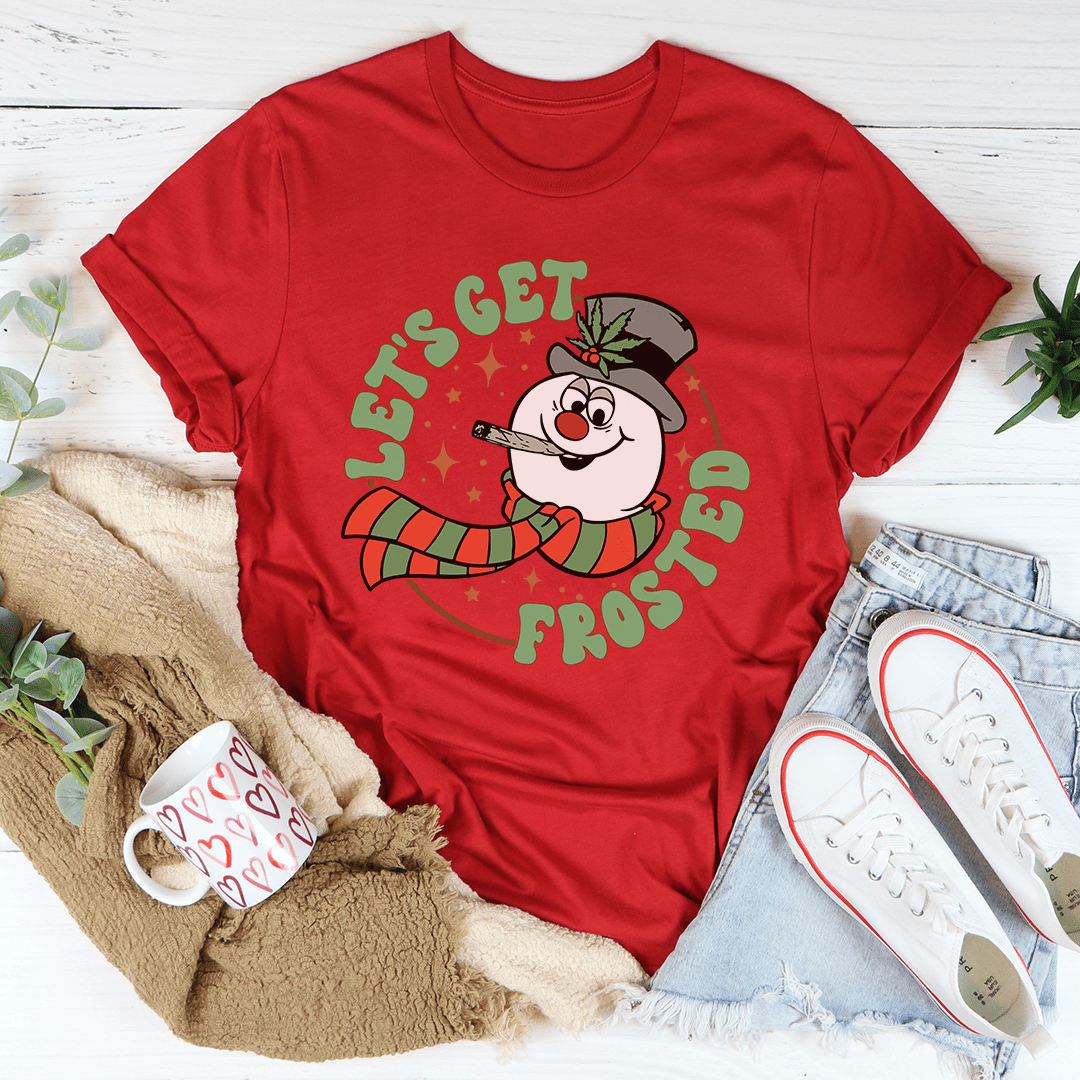 A festive Let's Get Frosted Tee featuring a cheerful Christmas design, made from 100% soft cotton, perfect for holiday celebrations.