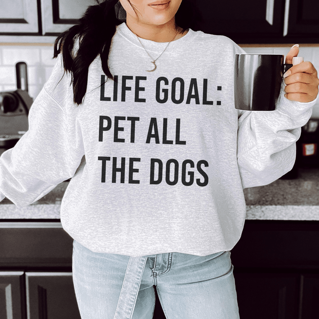 Cozy sweatshirt featuring the phrase 'Life Goal Pet All The Dogs', designed for dog lovers, made from cotton/poly fleece blend.