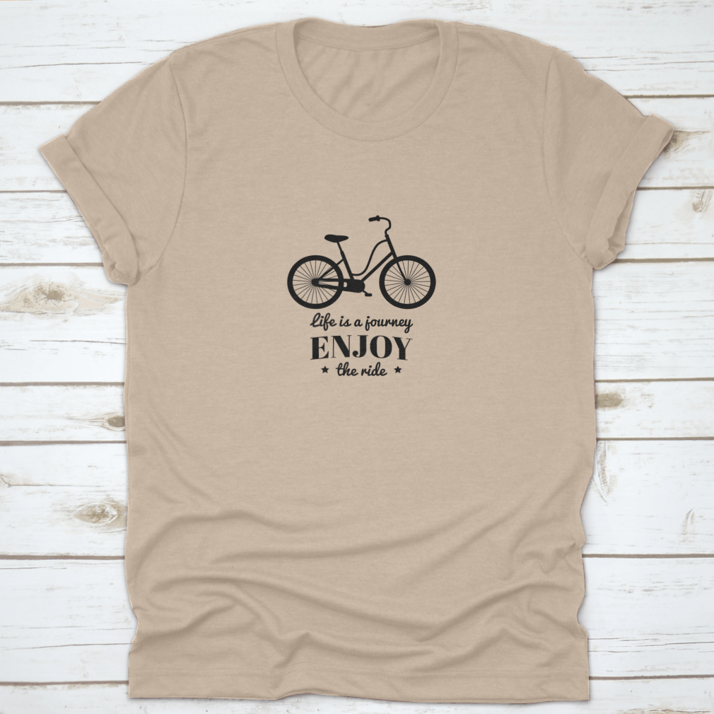 A motivational quote t-shirt featuring 'Life Is A Journey, Enjoy The Ride' printed on it, made from soft cotton fabric.