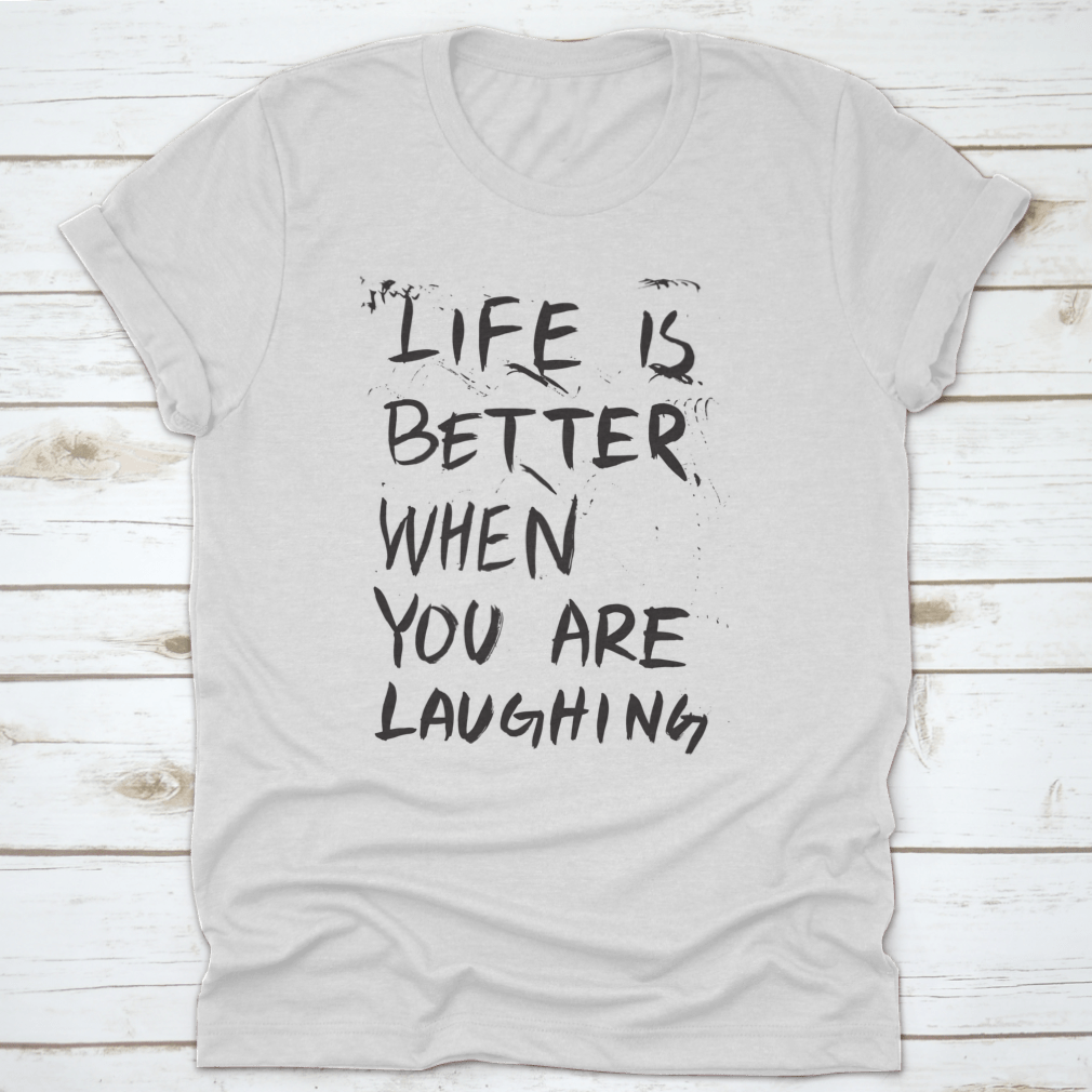 A comfortable t-shirt featuring an isolated vector illustration of the phrase 'Life Is Better When You Are Laughing', showcasing a joyful design.