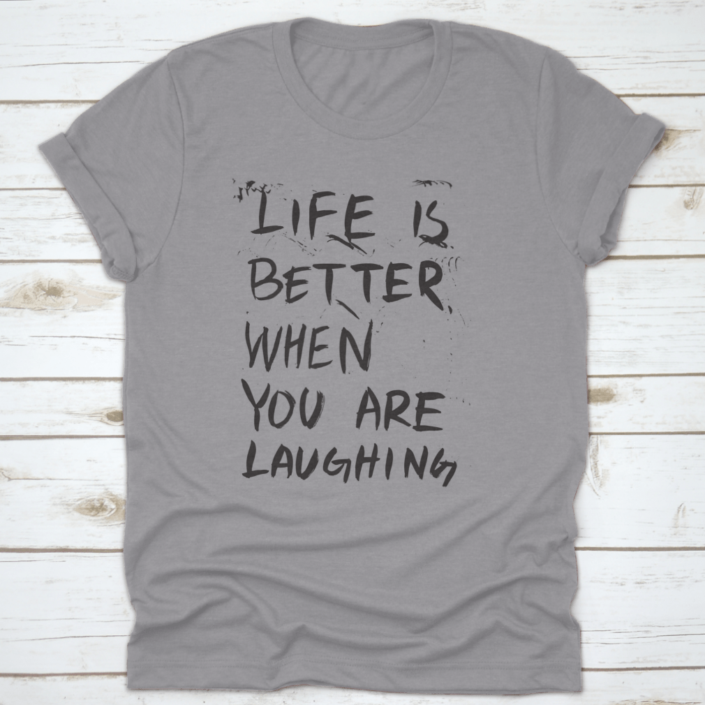 A comfortable t-shirt featuring an isolated vector illustration of the phrase 'Life Is Better When You Are Laughing', showcasing a joyful design.