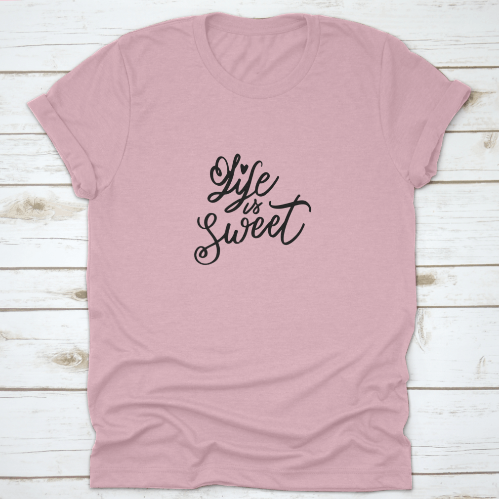 Life Is Sweet T-shirt featuring hand-drawn lettering design on a soft cotton fabric, showcasing a motivational message.