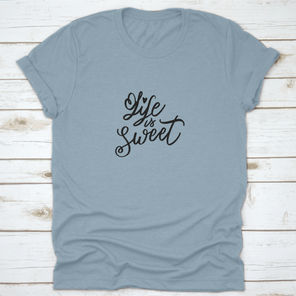 Life Is Sweet T-shirt featuring hand-drawn lettering design on a soft cotton fabric, showcasing a motivational message.