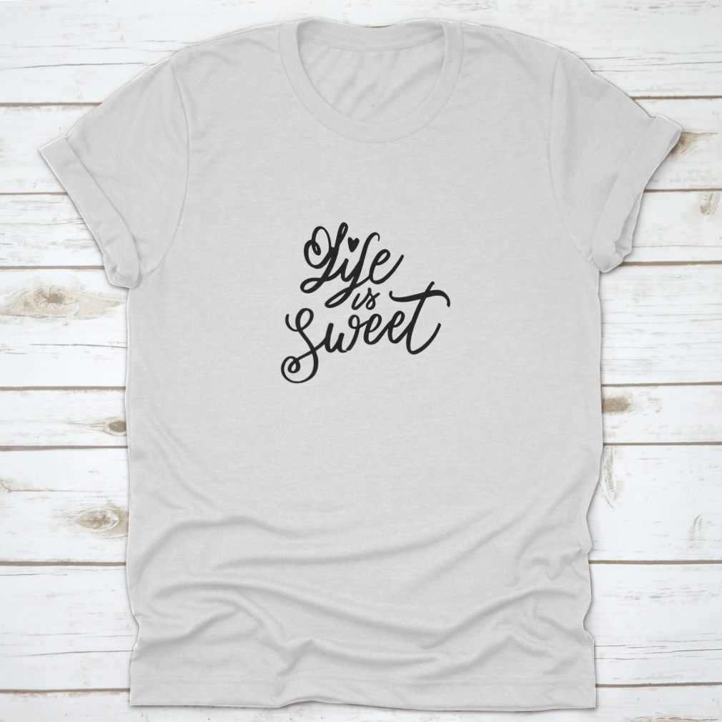 Life Is Sweet T-shirt featuring hand-drawn lettering design on a soft cotton fabric, showcasing a motivational message.