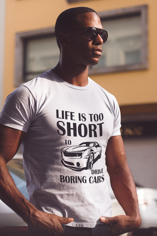 A stylish unisex t-shirt featuring the phrase 'Life is Too Short to be Driving Boring Cars', made from soft ring-spun cotton.