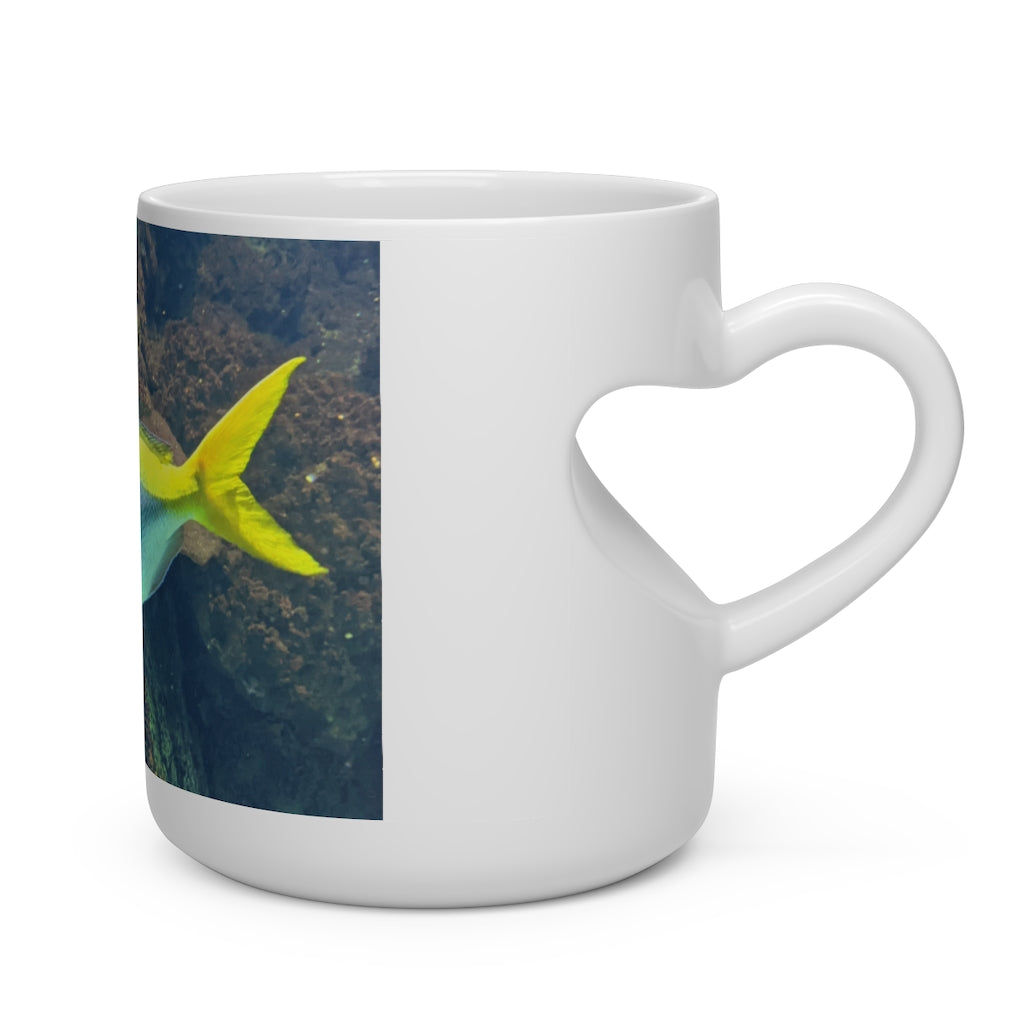 Light Blue and Yellow Fish Heart Shape Mug with a heart-shaped handle, featuring a playful fish pattern on a white ceramic surface.