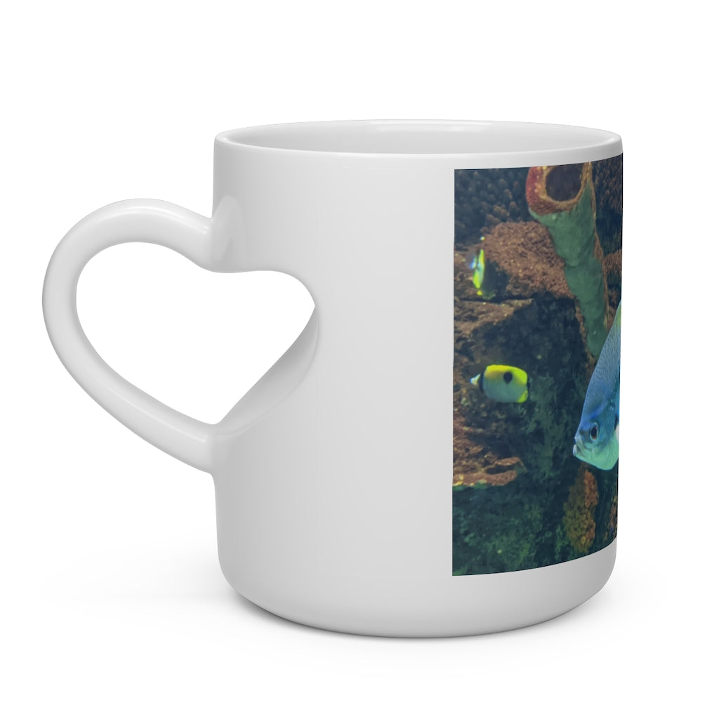 Light Blue and Yellow Fish Heart Shape Mug with a heart-shaped handle, featuring a playful fish pattern on a white ceramic surface.