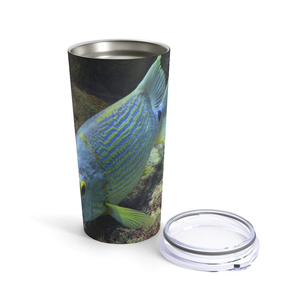 Light Blue Fish Tumbler 20oz made of stainless steel with a see-thru plastic lid, showcasing a stylish design perfect for travel.