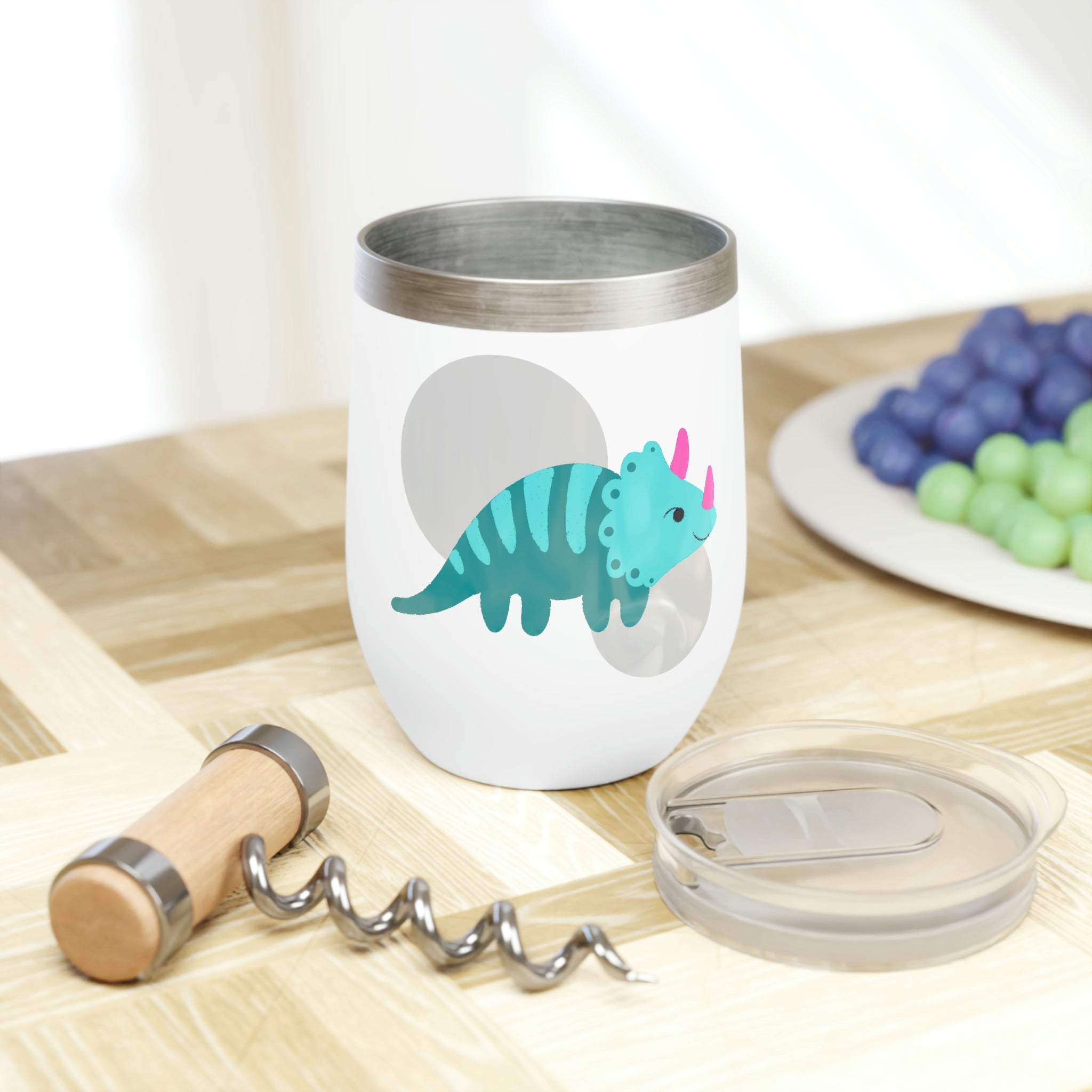 Light blue stainless steel wine tumbler featuring a playful triceratops design, perfect for keeping drinks at the ideal temperature.