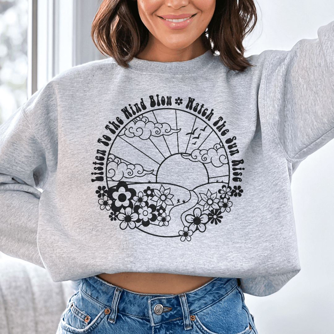 A cozy hoodie featuring the design 'Listen To The Wind Blow', made from a soft cotton/poly fleece blend, perfect for casual wear.