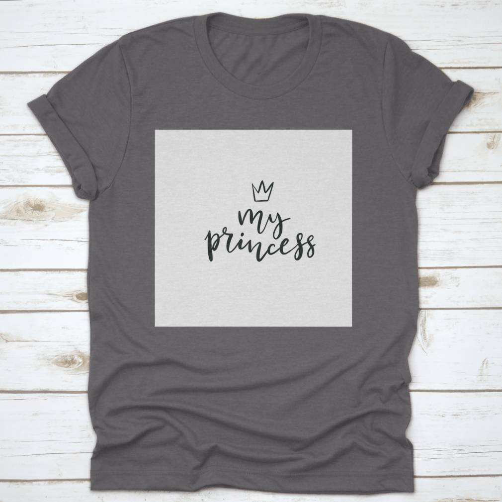 A stylish cotton t-shirt featuring a Little Princess Crown Calligraphy design, showcasing elegance and personalization.