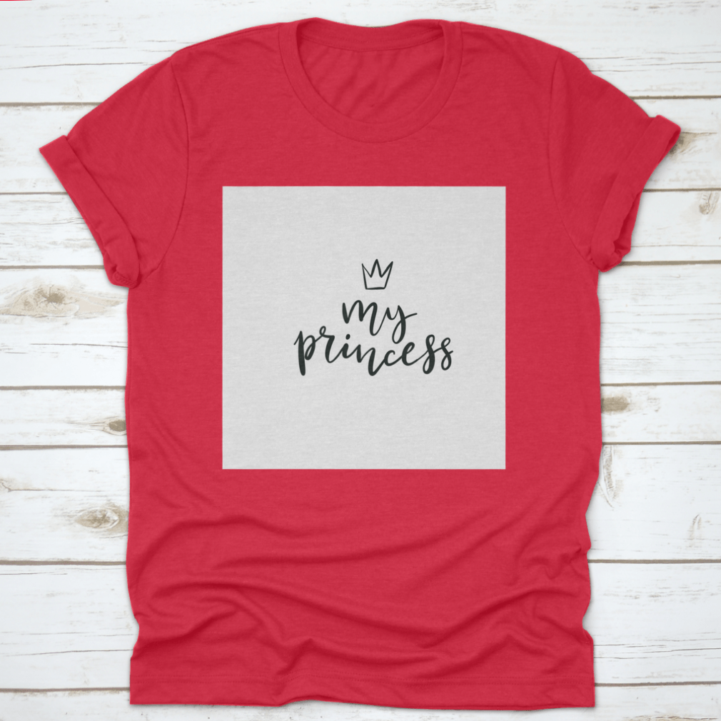 A stylish cotton t-shirt featuring a Little Princess Crown Calligraphy design, showcasing elegance and personalization.