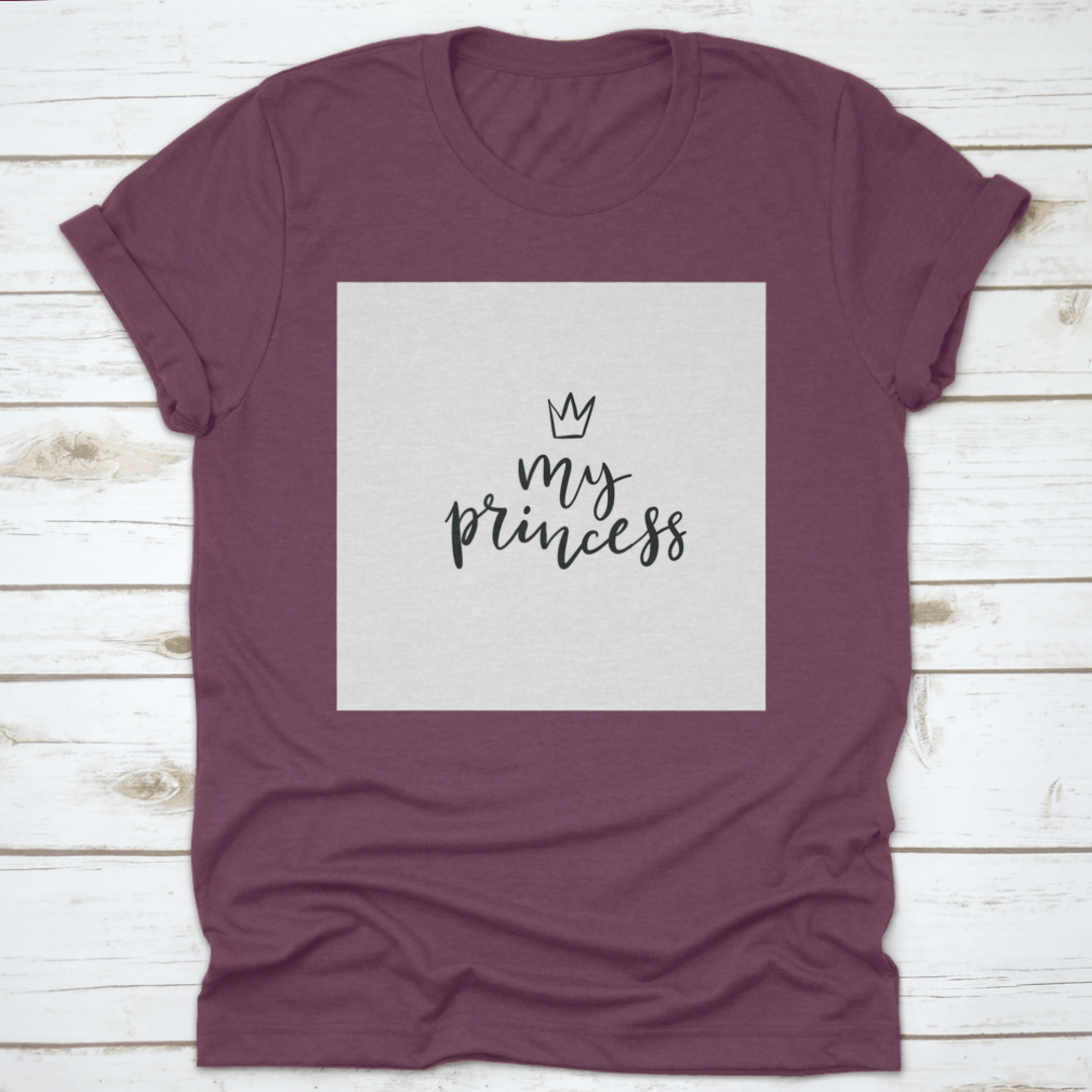 A stylish cotton t-shirt featuring a Little Princess Crown Calligraphy design, showcasing elegance and personalization.