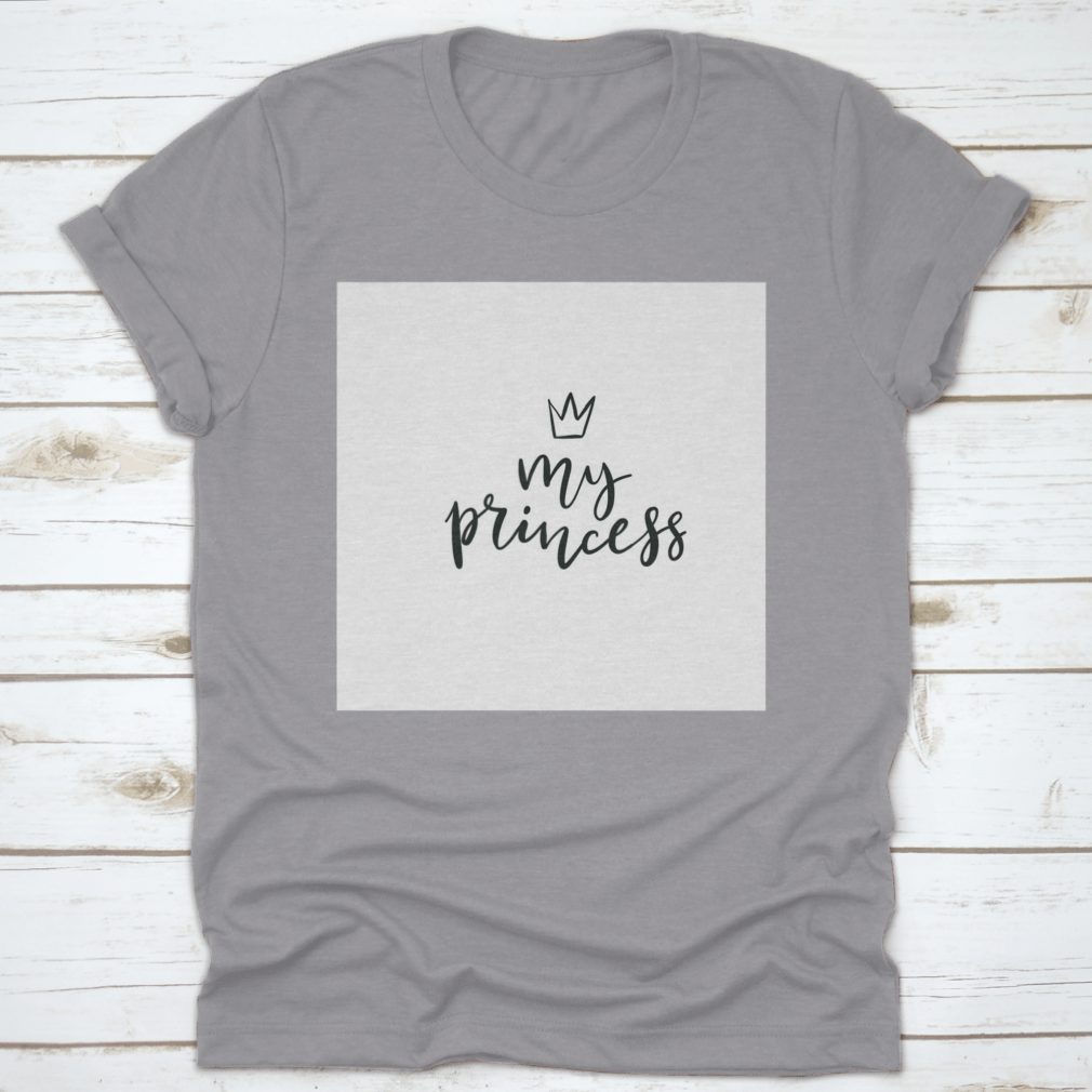 A stylish cotton t-shirt featuring a Little Princess Crown Calligraphy design, showcasing elegance and personalization.