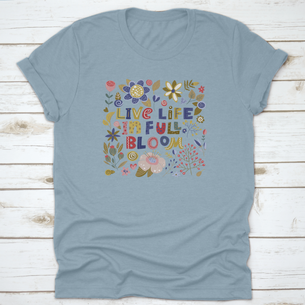 A stylish t-shirt featuring the motivational quote 'Live Life In Full Bloom' designed with vibrant colors and a classic fit, perfect for inspiring positivity.
