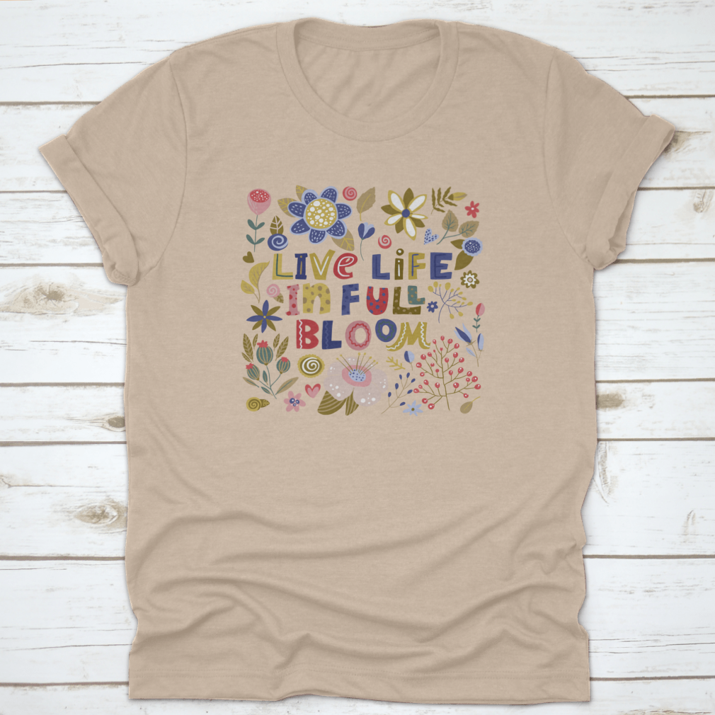 A stylish t-shirt featuring the motivational quote 'Live Life In Full Bloom' designed with vibrant colors and a classic fit, perfect for inspiring positivity.