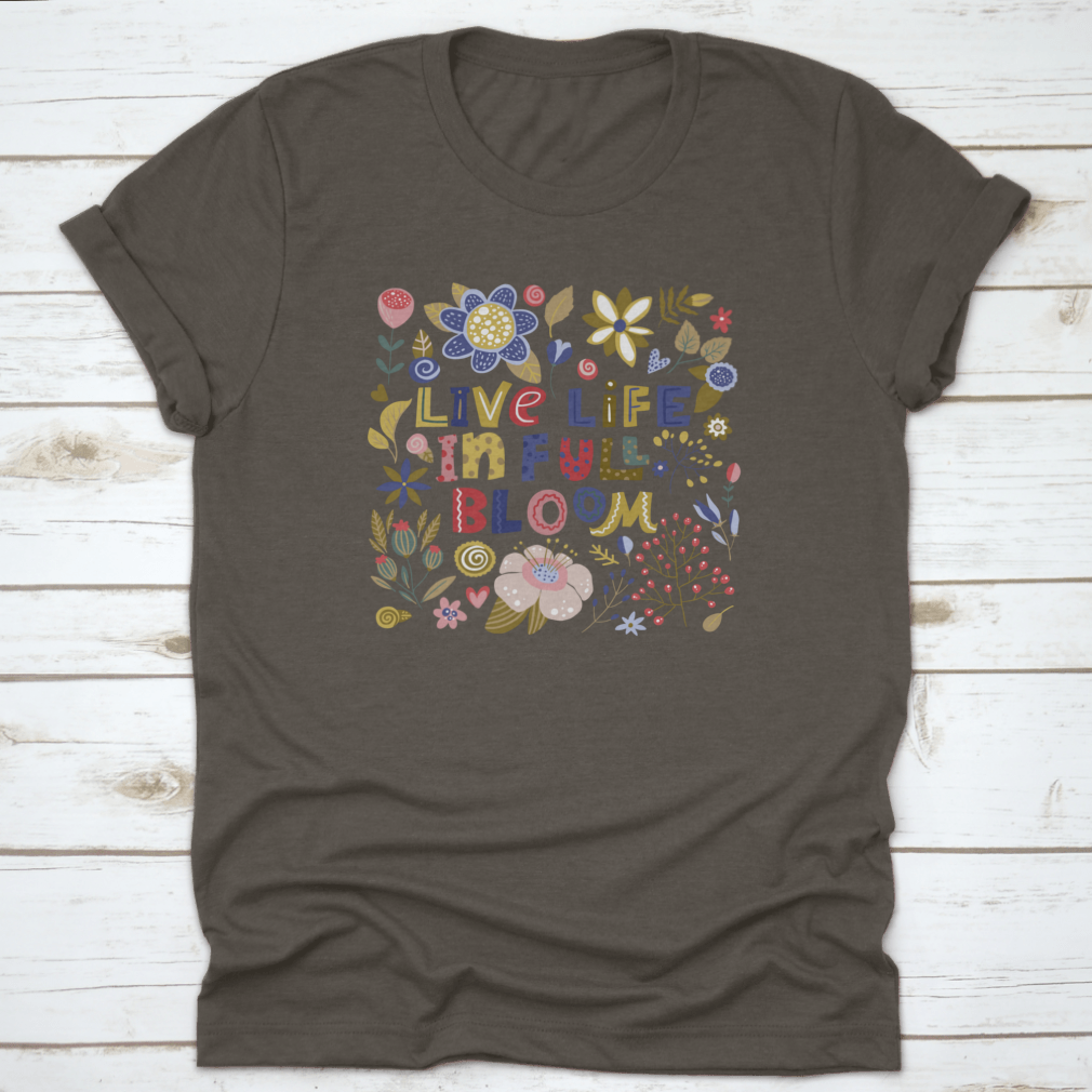 A stylish t-shirt featuring the motivational quote 'Live Life In Full Bloom' designed with vibrant colors and a classic fit, perfect for inspiring positivity.