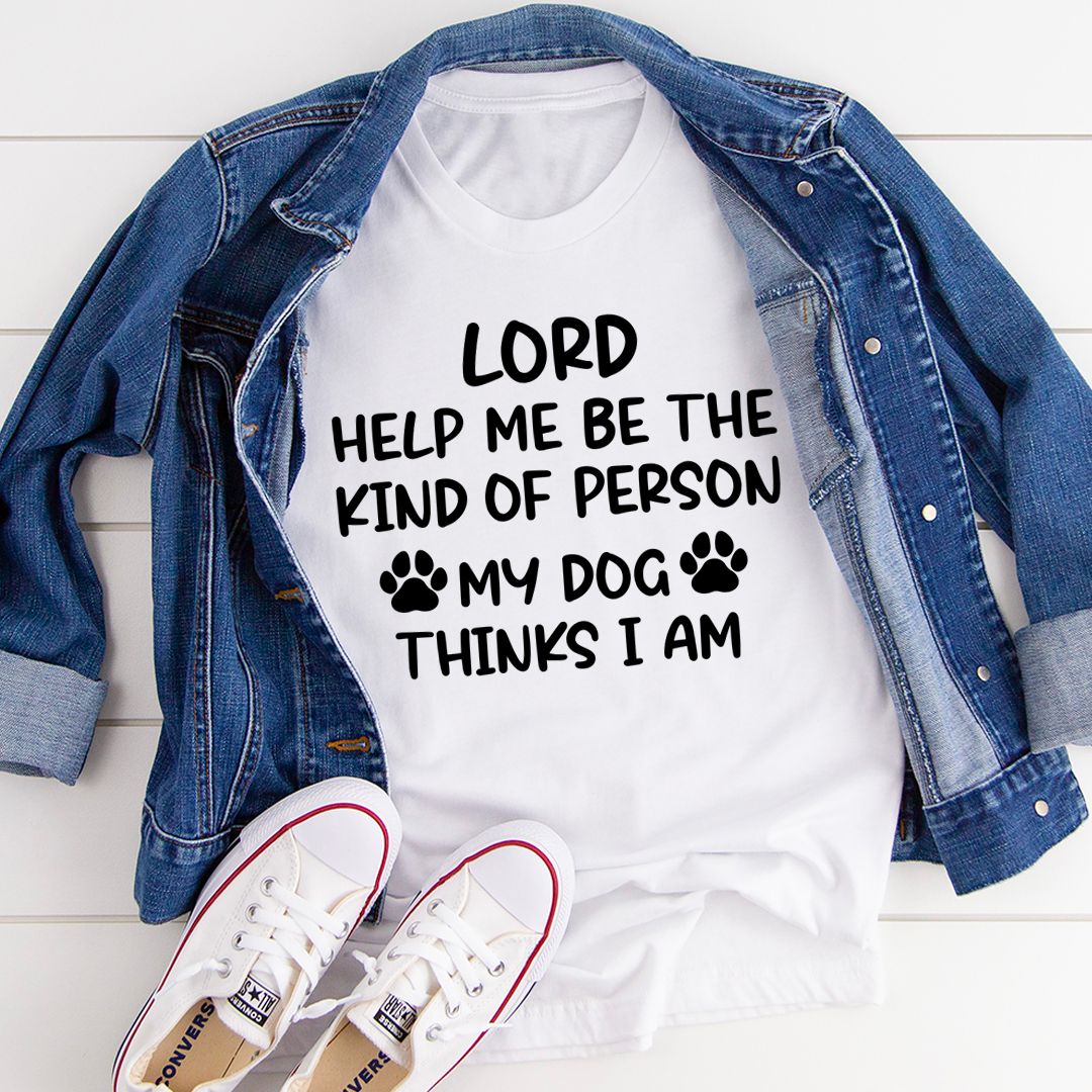 A comfortable and durable t-shirt featuring the phrase 'Lord Help Me Be The Kind Of Person My Dog Thinks I Am', perfect for dog lovers.