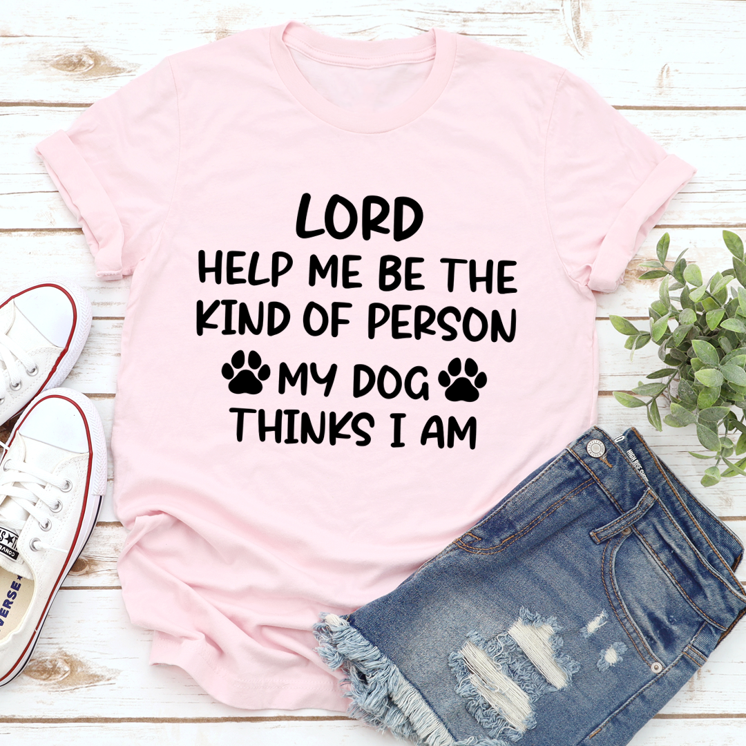 A comfortable and durable t-shirt featuring the phrase 'Lord Help Me Be The Kind Of Person My Dog Thinks I Am', perfect for dog lovers.