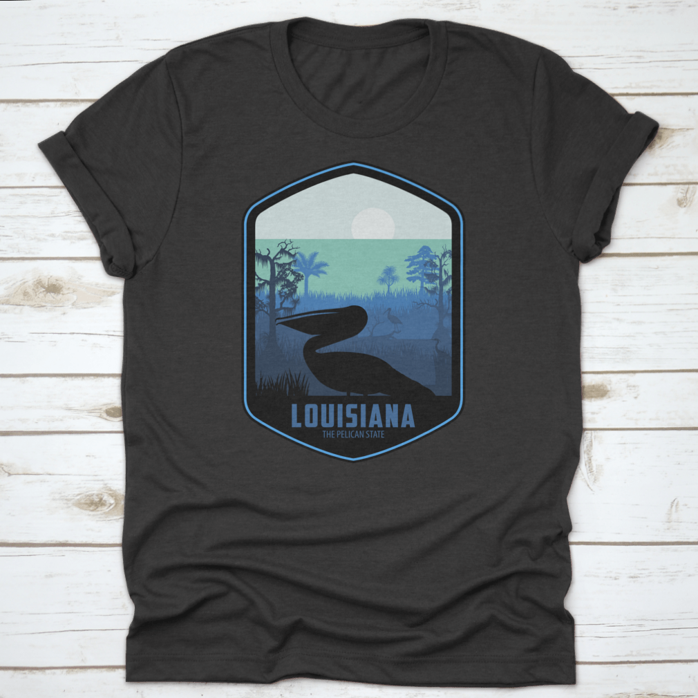 A stylish graphic T-shirt featuring the artistic design of Louisiana's Pelican State, made from soft cotton fabric.