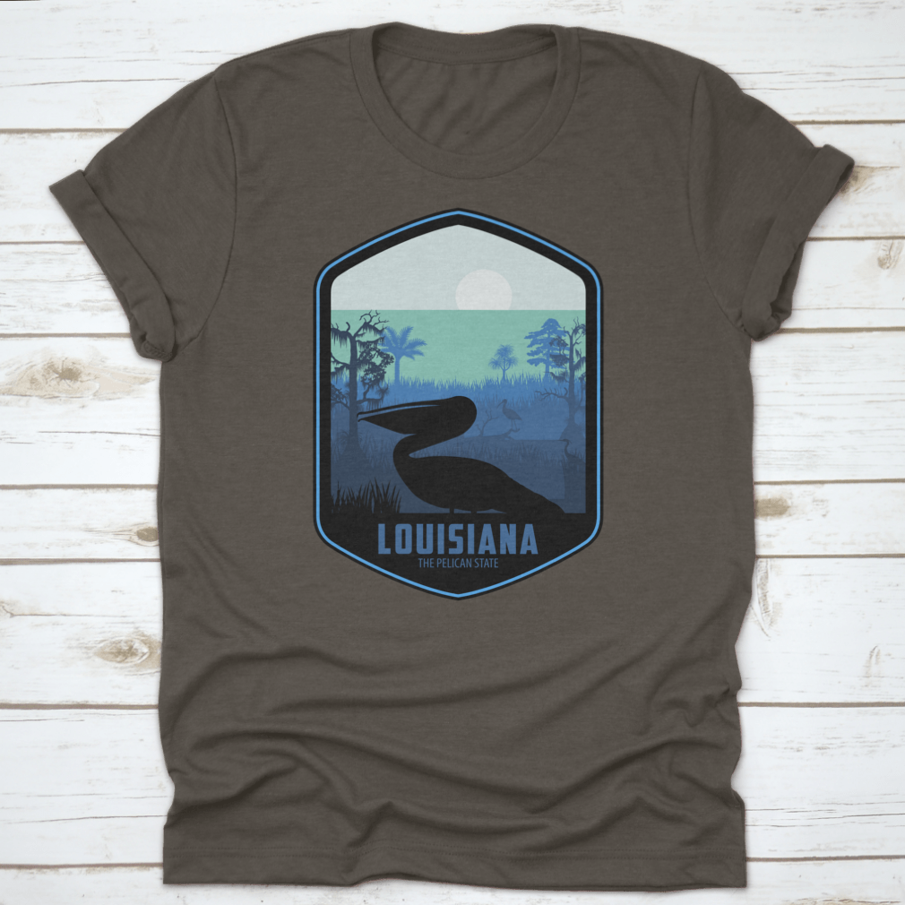 A stylish graphic T-shirt featuring the artistic design of Louisiana's Pelican State, made from soft cotton fabric.