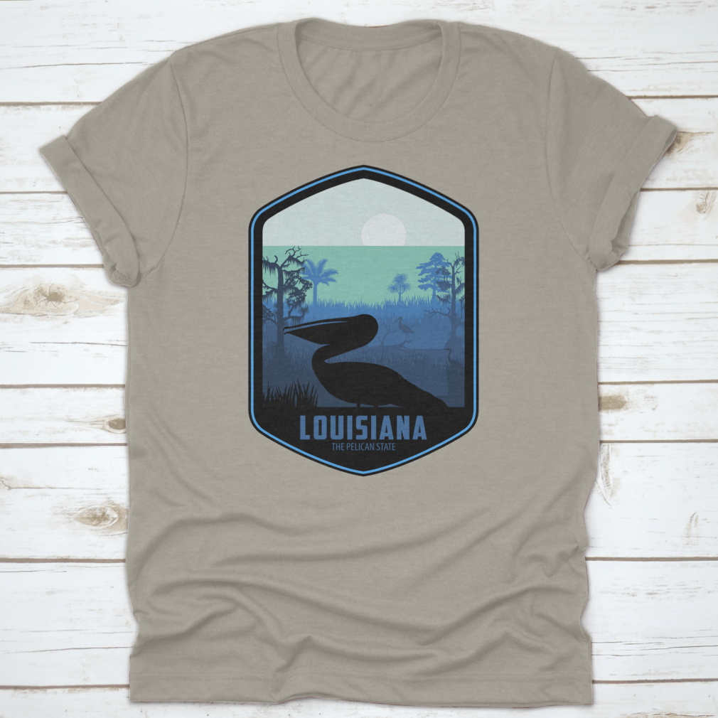 A stylish graphic T-shirt featuring the artistic design of Louisiana's Pelican State, made from soft cotton fabric.