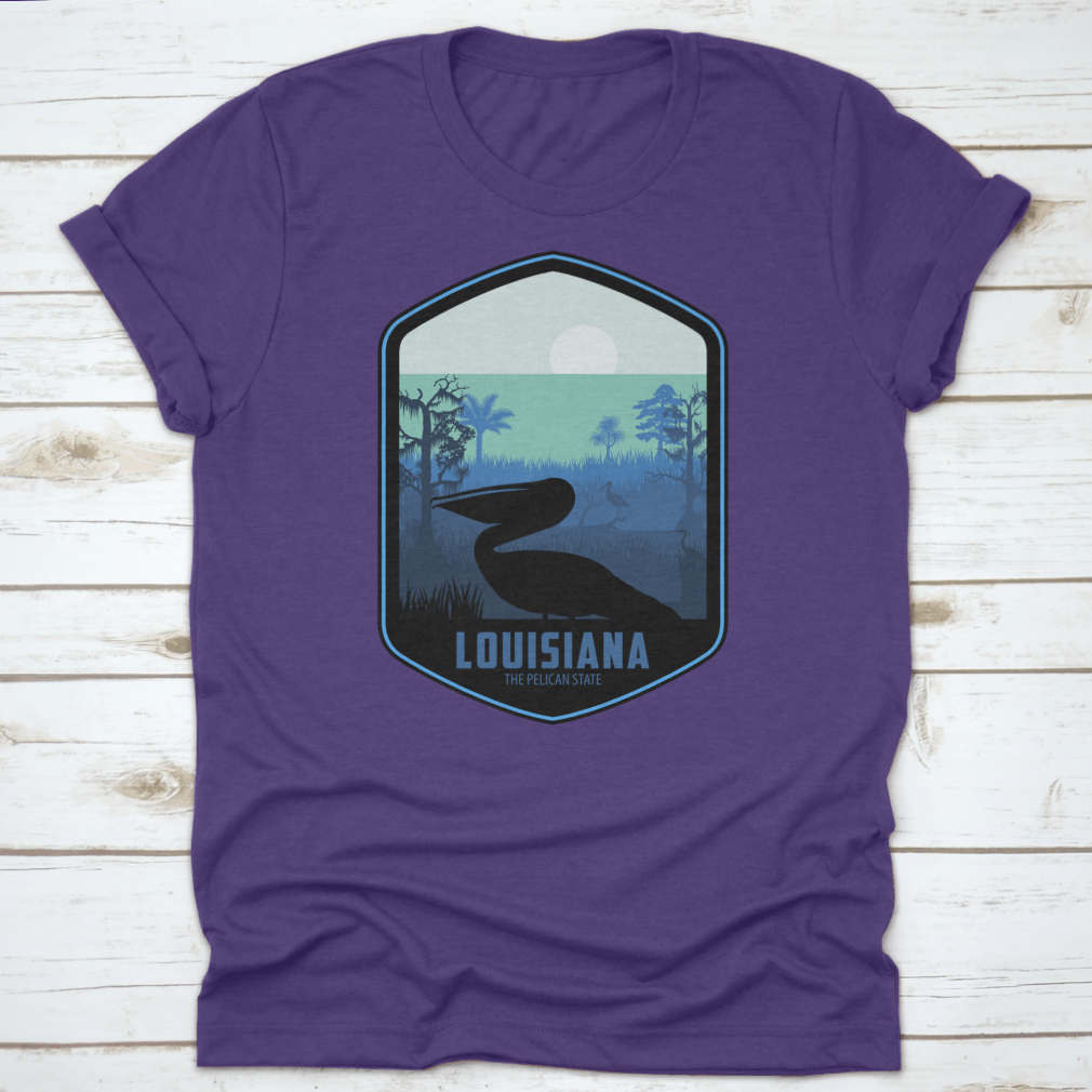 A stylish graphic T-shirt featuring the artistic design of Louisiana's Pelican State, made from soft cotton fabric.