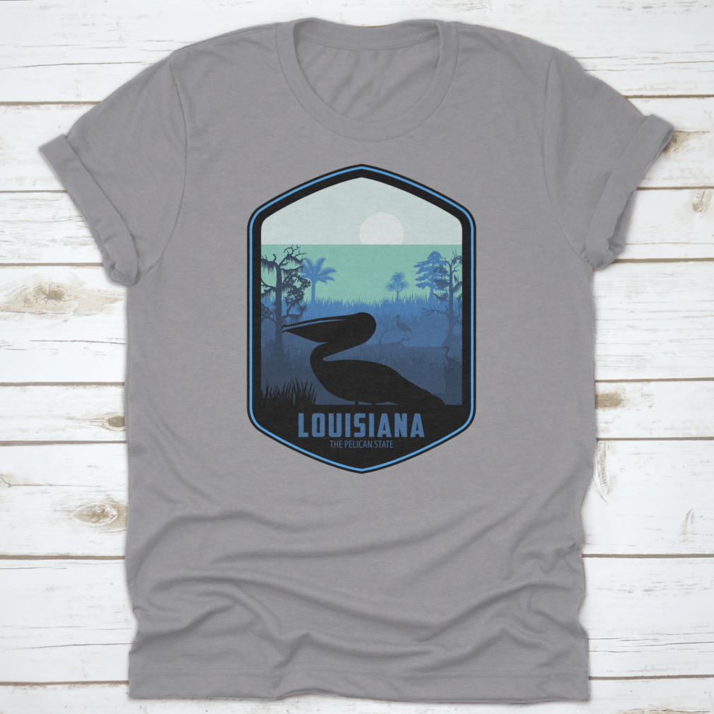 A stylish graphic T-shirt featuring the artistic design of Louisiana's Pelican State, made from soft cotton fabric.