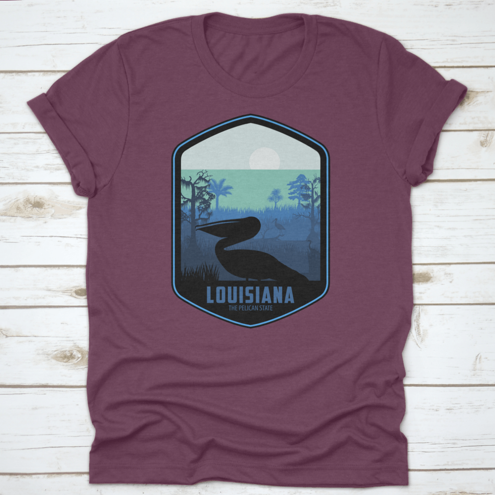 A stylish graphic T-shirt featuring the artistic design of Louisiana's Pelican State, made from soft cotton fabric.