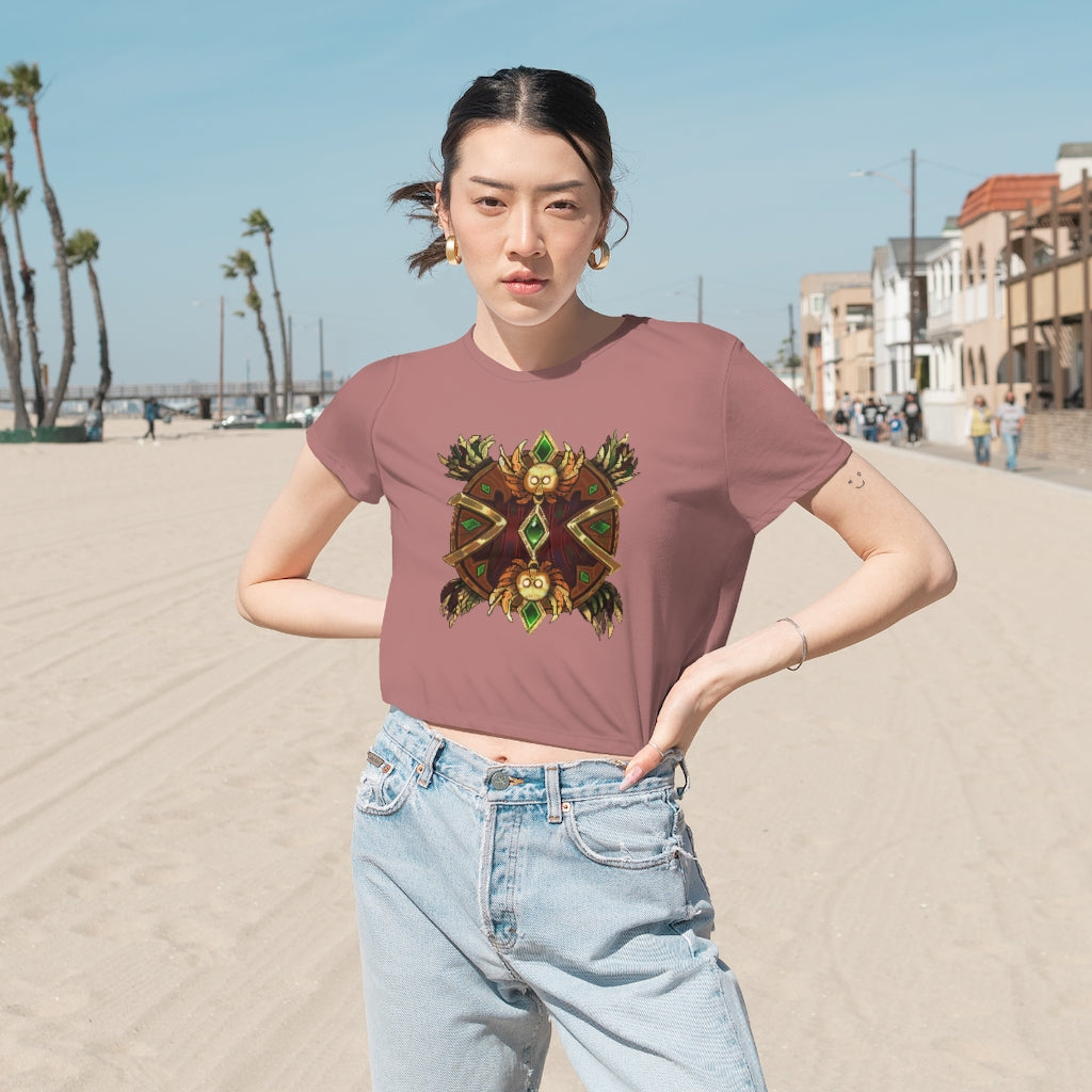 Magic Counter Shield Women's Flowy Cropped Tee in a stylish design, showcasing its flowy fit and modest crop style.