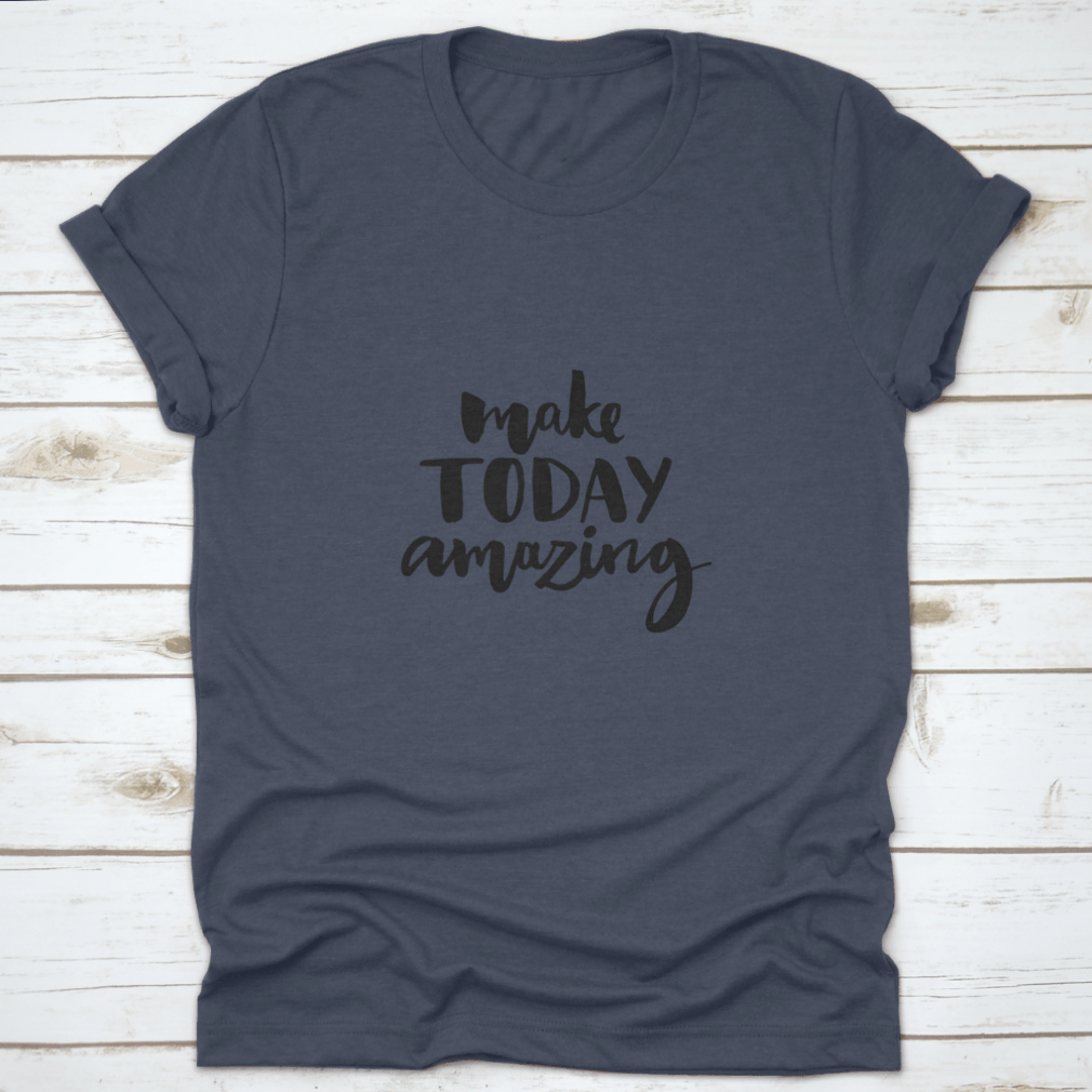 A stylish shirt featuring the handwritten inspirational quote 'Make Today Amazing' in black ink on a soft fabric background.