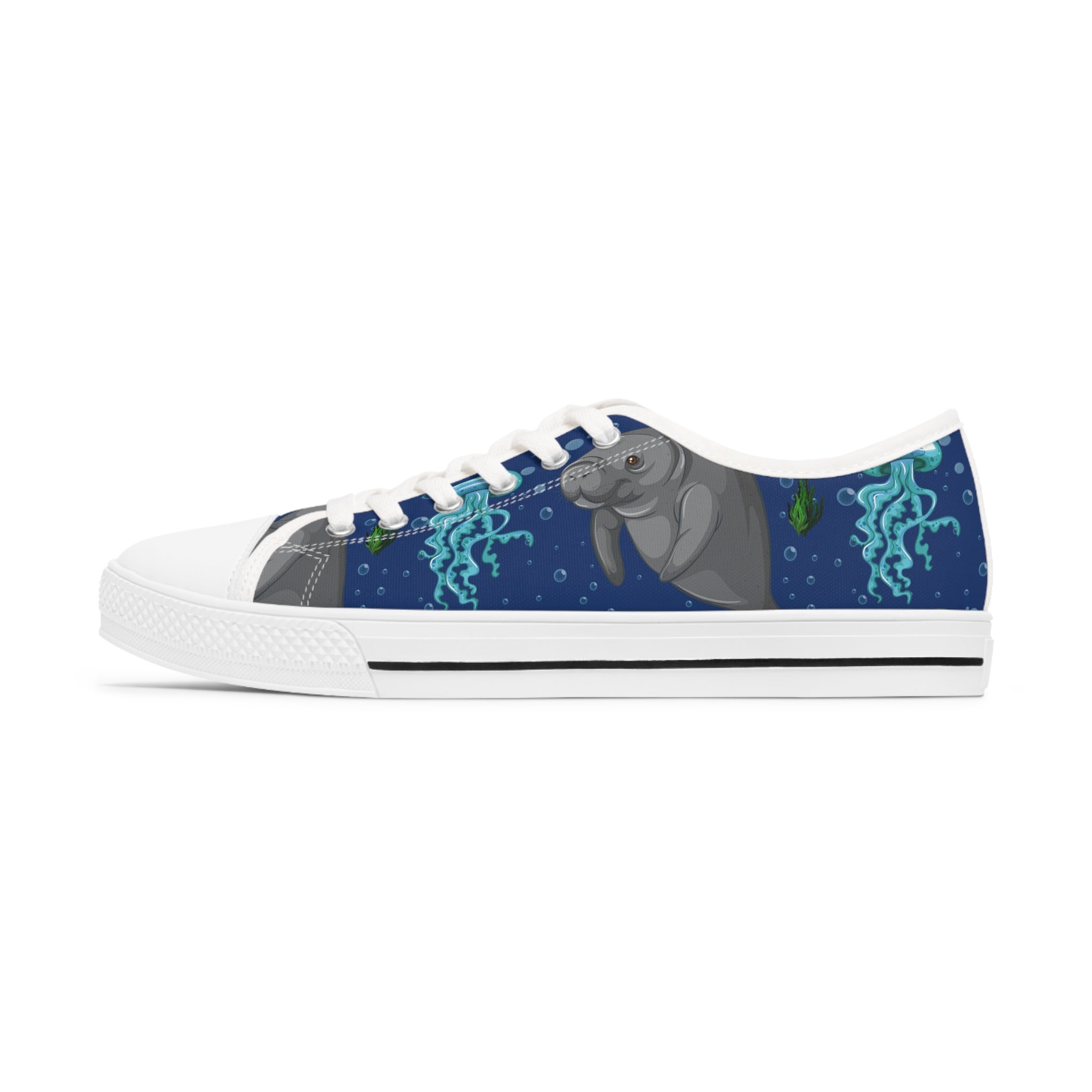 A pair of stylish Manatee Women's Low Top Sneakers in black and white, showcasing breathable canvas and memory foam insoles.